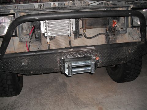 1991 Ford Bronco - Front view of a 1991 Ford Bronco showing a winch mounted on the bumper and an oil cooler behind the grille.
