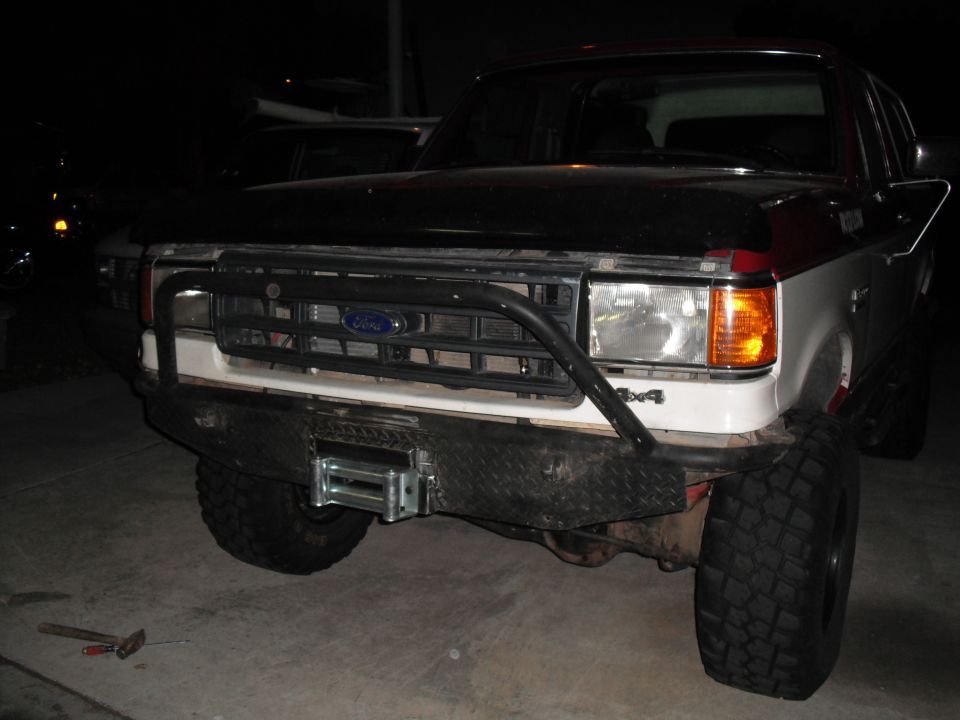 Front view of a 1991 Ford Bronco with a winch and bull bar