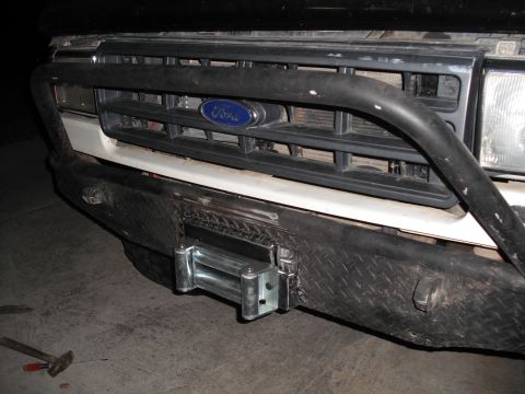 1991 Ford Bronco - Front view of a 1991 Ford Bronco, a custom bumper with a winch.