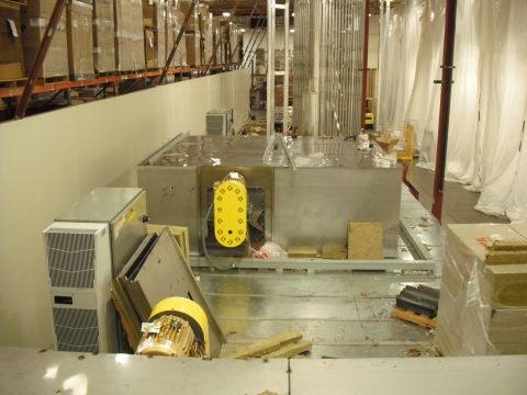 1991 Ford Bronco - An industrial HVAC unit is seen in a warehouse setting, surrounded by shelving and materials.