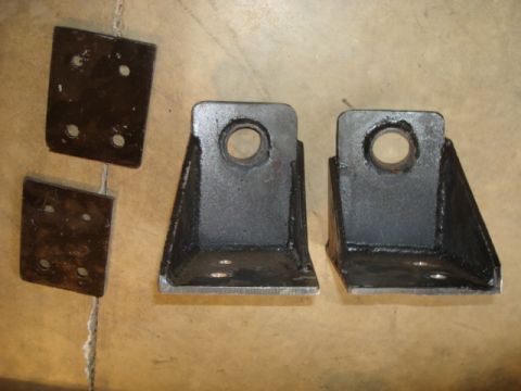 1995 Ford Bronco - Metal brackets are displayed on a textured surface, with a website address visible at the bottom right.