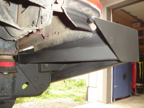 1989 Ford Bronco - Close-up view of an aftermarket bumper part on a vehicle's undercarriage.