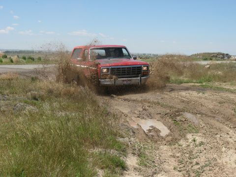 1981 Ford Bronco - Trying out the new tires in the mud. Yeah!