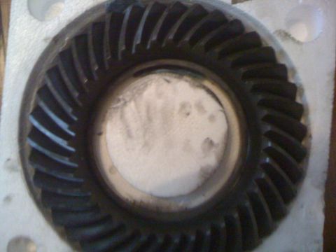 1995 Ford Bronco - A close-up view of a differential gear, likely removed for maintenance or inspection.