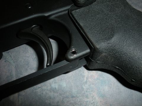 1996 Ford Bronco - Close-up of a firearm's trigger and grip mechanism.