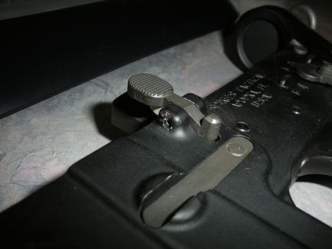 1996 Ford Bronco - Detail of a firearm's selector switch and trigger mechanism, showing intricate metalwork.