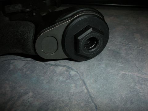 1996 Ford Bronco - A close-up shows a component with a hexagonal recess, likely part of a vehicle's mechanical system.