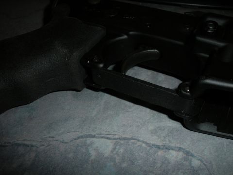 1996 Ford Bronco - Detail of a firearm's trigger and grip mechanism, with a SuperMotors.net watermark visible.