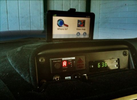 2005 Subaru Impreza - Interior view of a vehicle's dashboard a Garmin GPS unit and a Valentine One radar detector with a digital display.