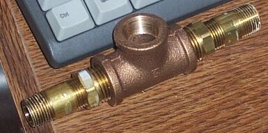 1990 Ford Bronco - Heater hose tee for aftermarket water temp gauge, assembled from basic NPT components from the hardware store.