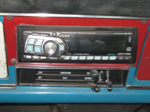 1972 Ford F-250 - The dashboard features an aftermarket Alpine CD receiver and manual climate controls with temperature and fan settings.