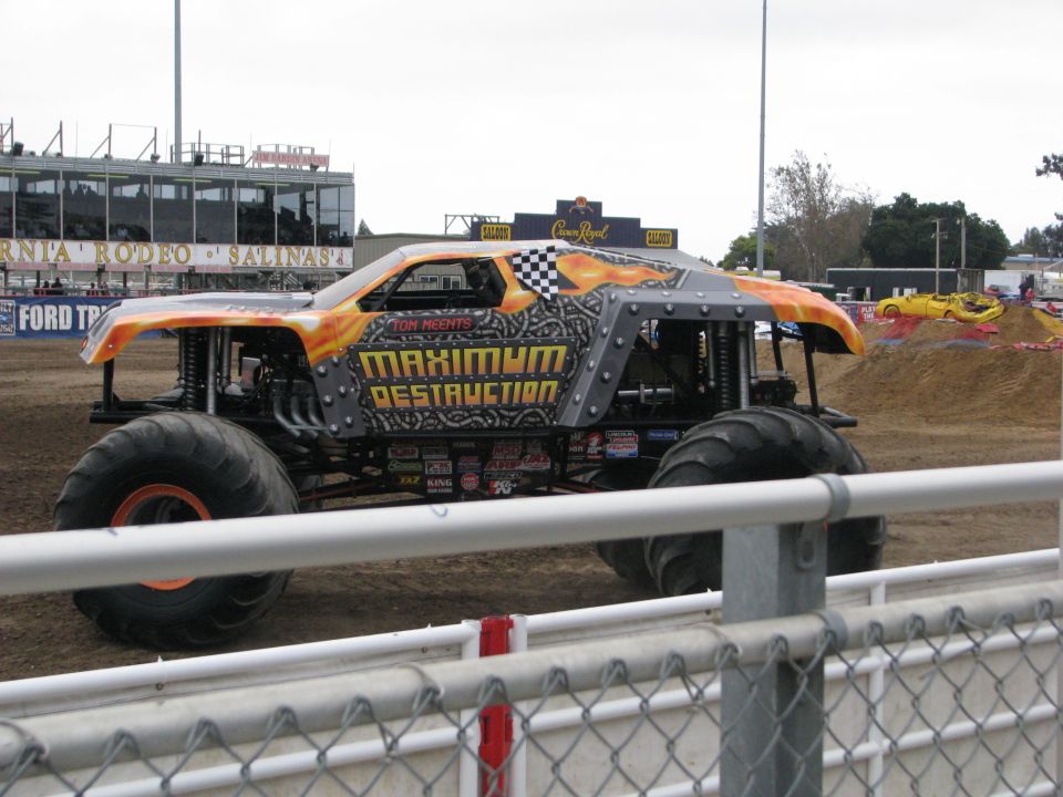 Monster truck with "Maximum Destruction" text, orange and grey paint scheme