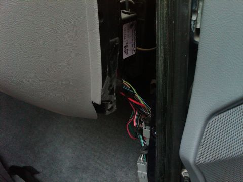 1995 Ford Bronco - Exposed wiring harness and connectors visible within the vehicle's interior paneling.