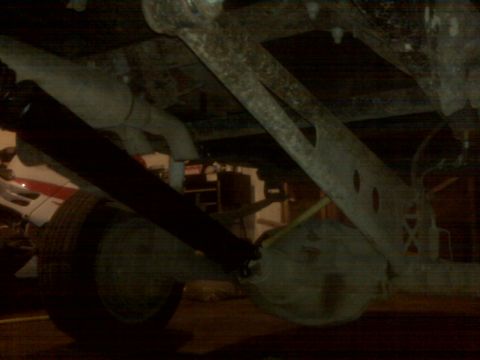 1994 Ford F-250 - Undercarriage view of a truck's rear axle and suspension components.
