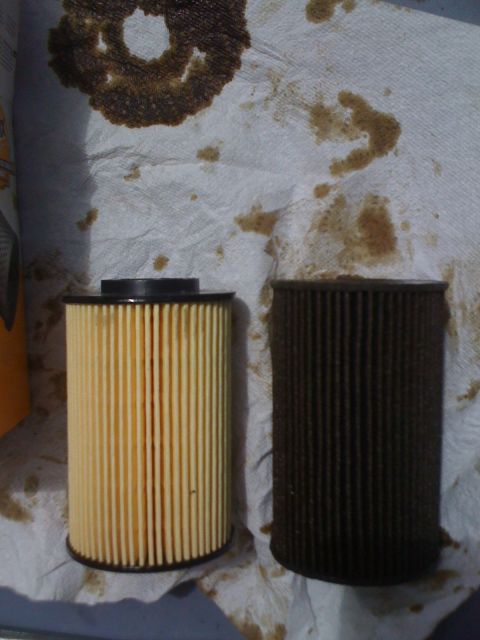 2010 Hyundai Genesis - Comparison of a new oil filter and a used, dirty oil filter.