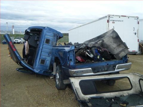 2005 Dodge 3500 - This 2005 Dodge 3500 pickup truck sustained severe damage and is overturned.