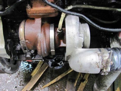 2005 Dodge 3500 - Close-up view of a vehicle's turbocharger, showing its components and connections.