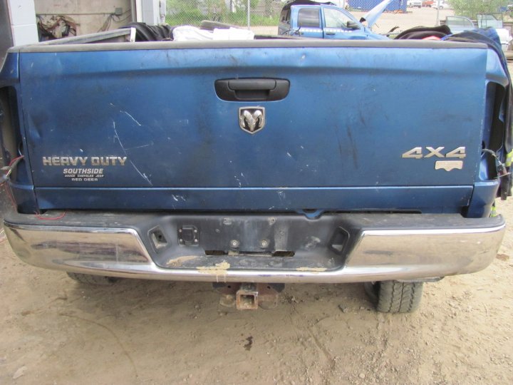 2005 Dodge 3500 pickup truck rear view with 'Heavy Duty' and '4x4' badges