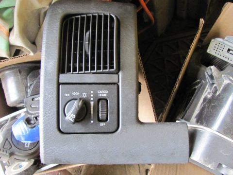 2005 Dodge 3500 - This is an interior dashboard part an air vent and controls for lights and cargo dome illumination.
