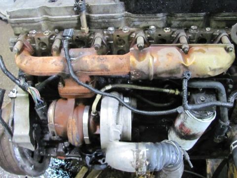 2005 Dodge 3500 - Close-up view of a diesel engine's turbocharger and associated components.