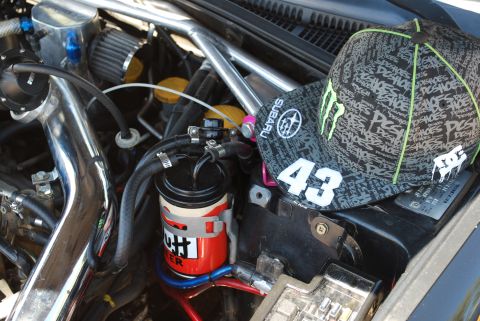 2005 Subaru Impreza - A baseball cap with a Subaru logo and the number 43 rests on the engine bay.