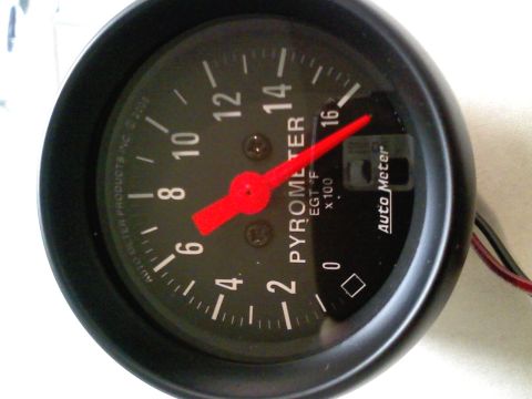 1990 Ford Bronco - Close-up of an Auto Meter pyrometer gauge, indicating EGT F x 100.