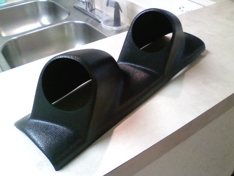 1990 Ford Bronco - This is a dual gauge pod, likely for aftermarket gauges, resting on a countertop.