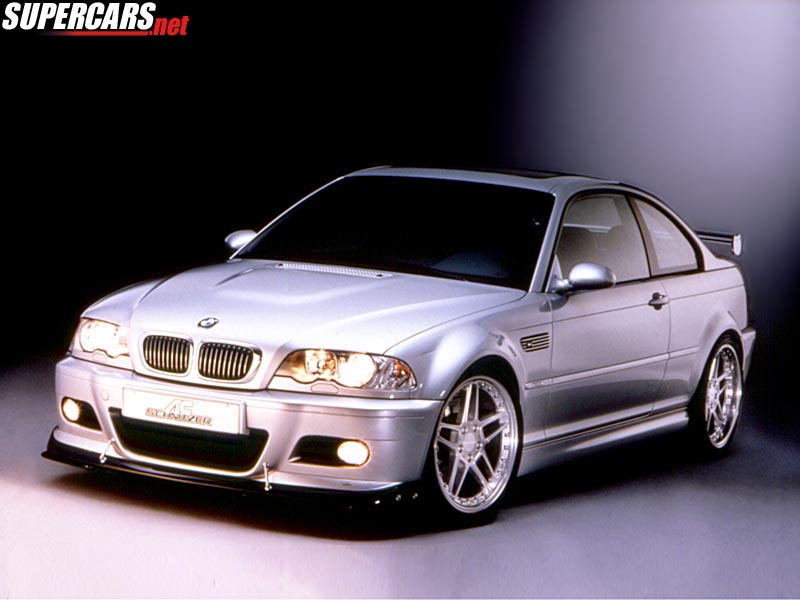 Silver BMW coupe with custom body kit and aftermarket wheels