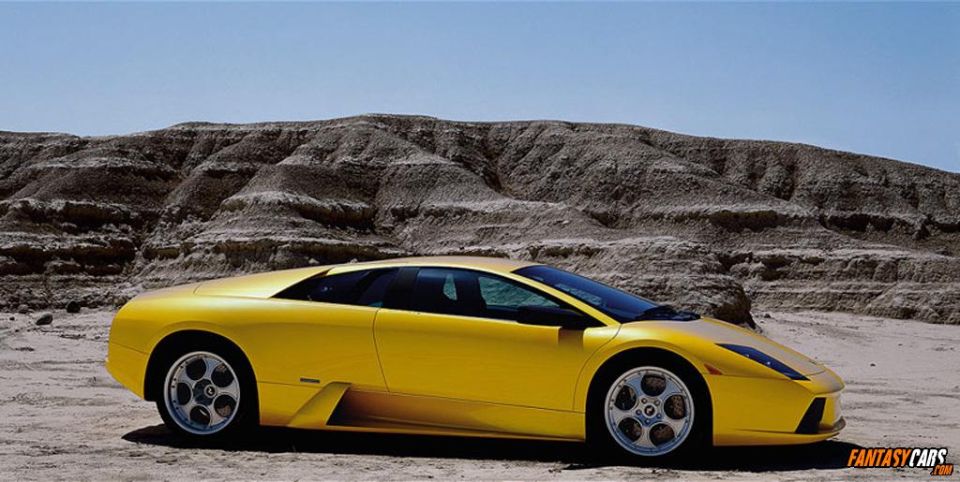 Yellow sports car parked in a desert landscape