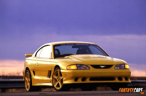 1998 Ford Crown Victoria - This yellow Saleen Mustang is shown from a three-quarter front view against a purple sky.