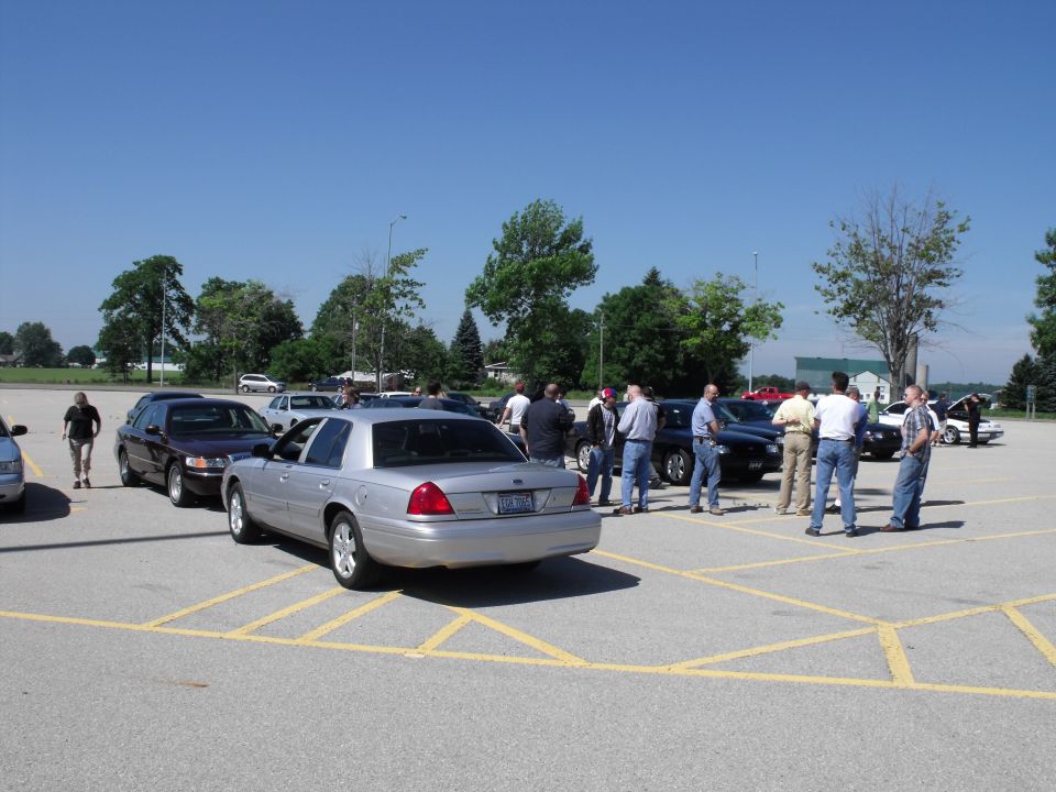 Silver 2003 Mercury Marauder rear view in a parking lot with people