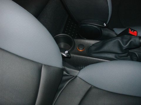 2003 Ford Crown Victoria - Close-up view of a car's interior, focusing on the center console and seating area.