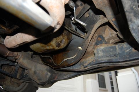 1994 Ford Bronco - Close-up view of the undercarriage, showing the exhaust system and frame components.