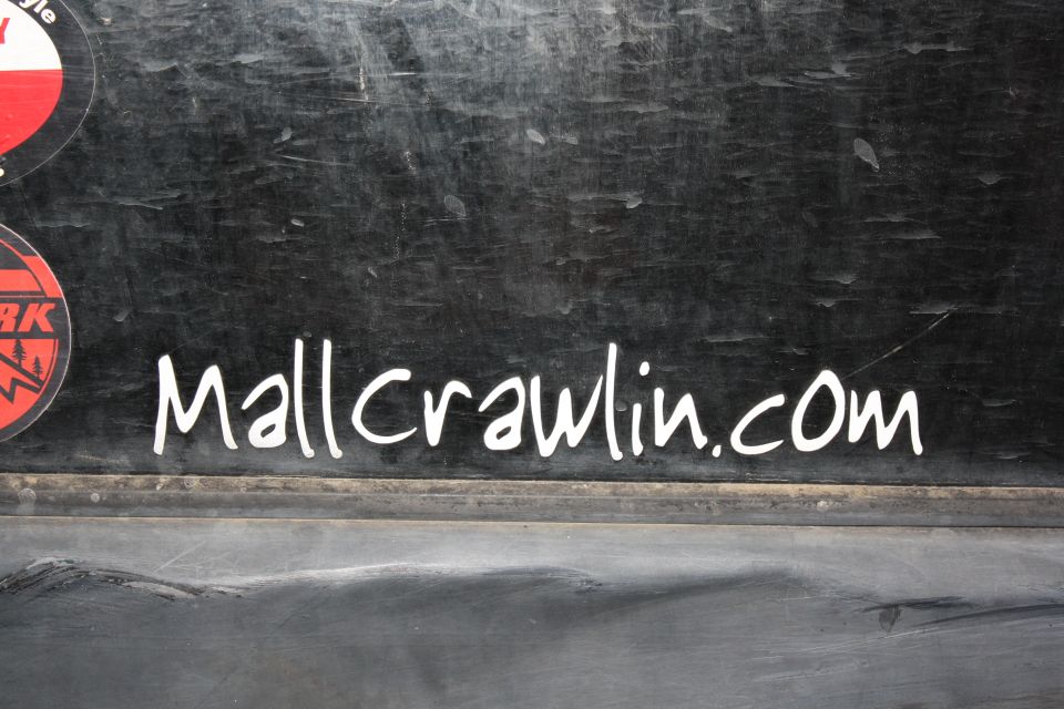 Sticker that says Mallcrawlin.com on the side of a vehicle
