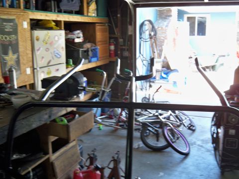 1985 Ford Bronco - Garage scene with bicycles and car parts, not a 1985 Ford Bronco.