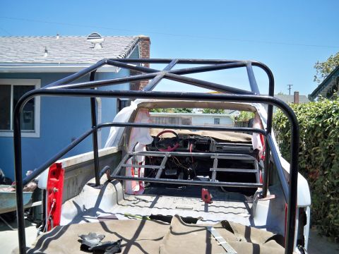 1985 Ford Bronco - This 1985 Ford Bronco is undergoing a custom rebuild, a prominent roll cage and a stripped-down interior.