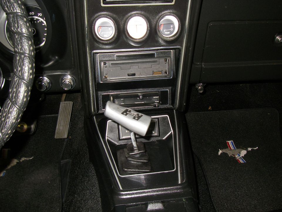 1971 Ford Mustang interior with floor mat pony emblem and shifter