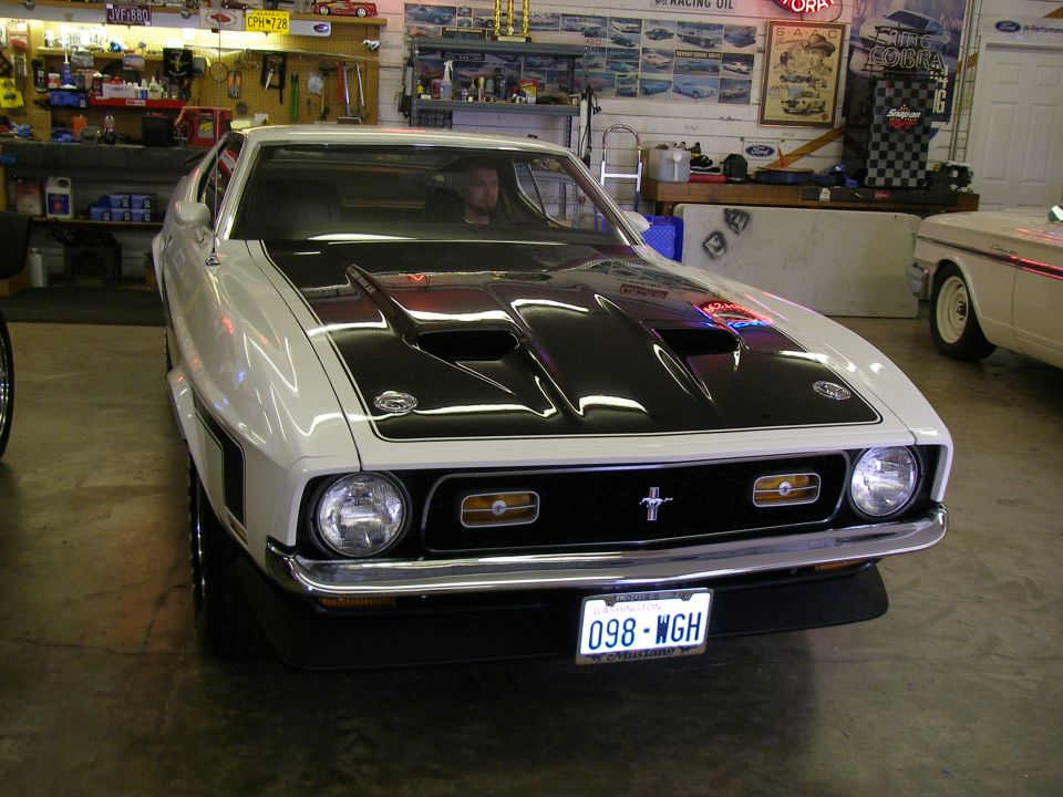 White 1971 Ford Mustang front view with black hood scoops and stripes