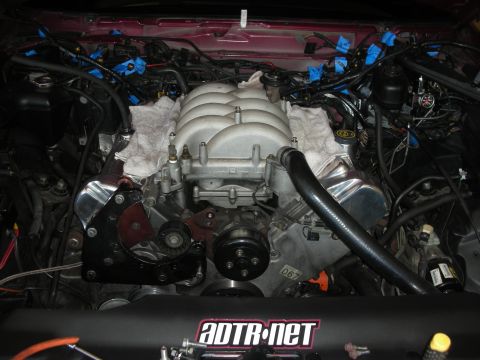 1992 Ford Crown Victoria - Engine bay components are visible, including the intake manifold, wiring harnesses, and hoses, with some parts covered by towels.