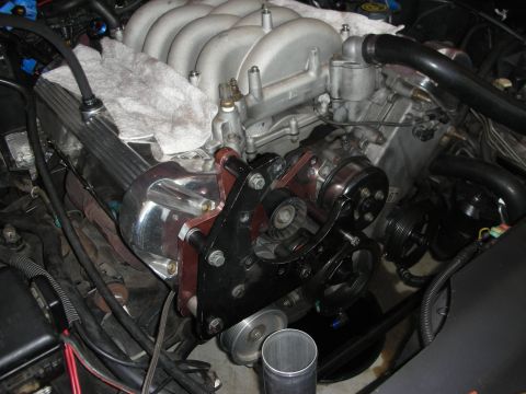 1992 Ford Crown Victoria - Close-up view of a modified engine with a supercharger, intake manifold, and associated components.