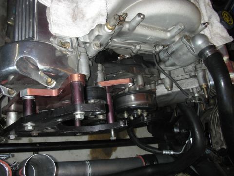 1992 Ford Crown Victoria - Close-up view of engine pulleys, belt, and custom-fabricated brackets.
