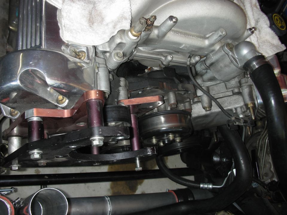 Engine pulleys and belt system with custom brackets