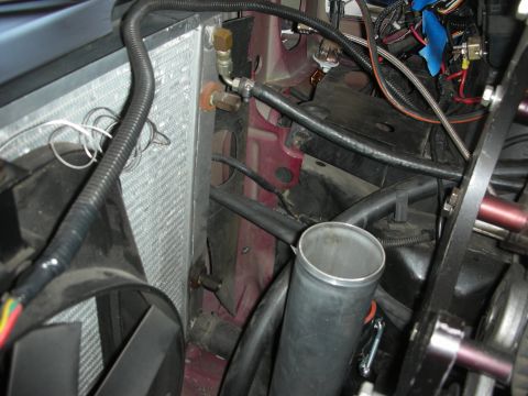 1992 Ford Crown Victoria - Close-up view of engine bay modifications, including a radiator and custom plumbing.