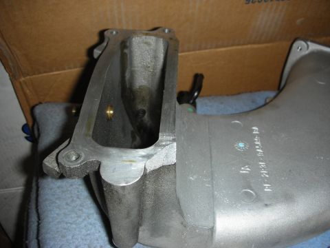 1992 Ford Crown Victoria - Close-up of an intake manifold, showing the part number F1231-9A485-BA stamped on its surface.
