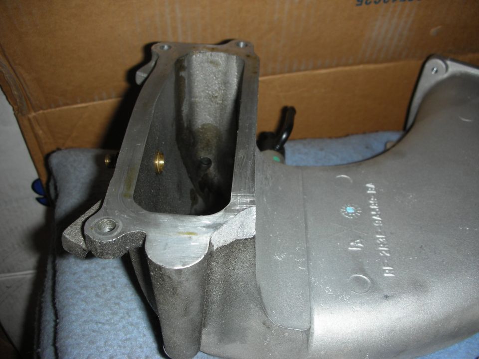 Intake manifold with part number F1231-9A485-BA visible