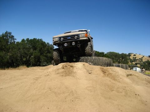 1989 Ford Bronco - A modified Ford Bronco navigates an off-road obstacle course.