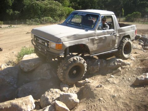 1989 Ford Bronco - This 1989 Ford Bronco navigates a rocky obstacle on an off-road course.