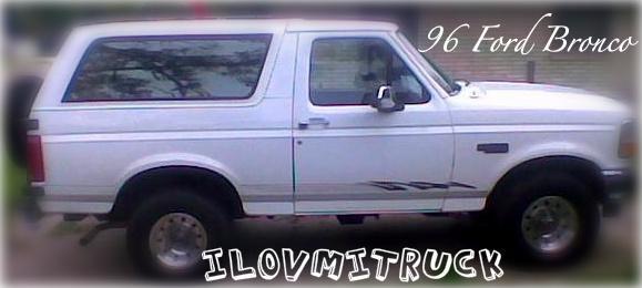 Side view of a white 1996 Ford Bronco with aftermarket decals on the lower body