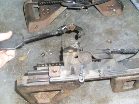 1996 Dodge 2500 - Close-up of a vehicle's seat adjustment mechanism, revealing its internal components and wear.
