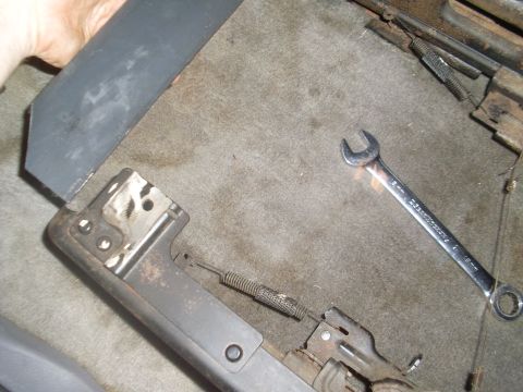 1996 Dodge 2500 - Car seat mechanism components and a wrench are visible on the carpeted floor.